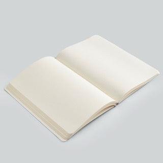 Open notebook with blank pages on a light gray background