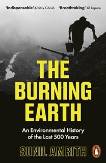 Book cover of 'The Burning Earth' by Sunil Amrith with a silhouette of a person on a mountain.