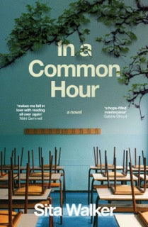 Book cover of 'In a Common Hour' by Sita Walker with a classroom scene of chairs and a wall in the background.