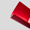Close-up of a red lnotebook on a light gray background