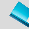 Blue notebnook on a light gray background