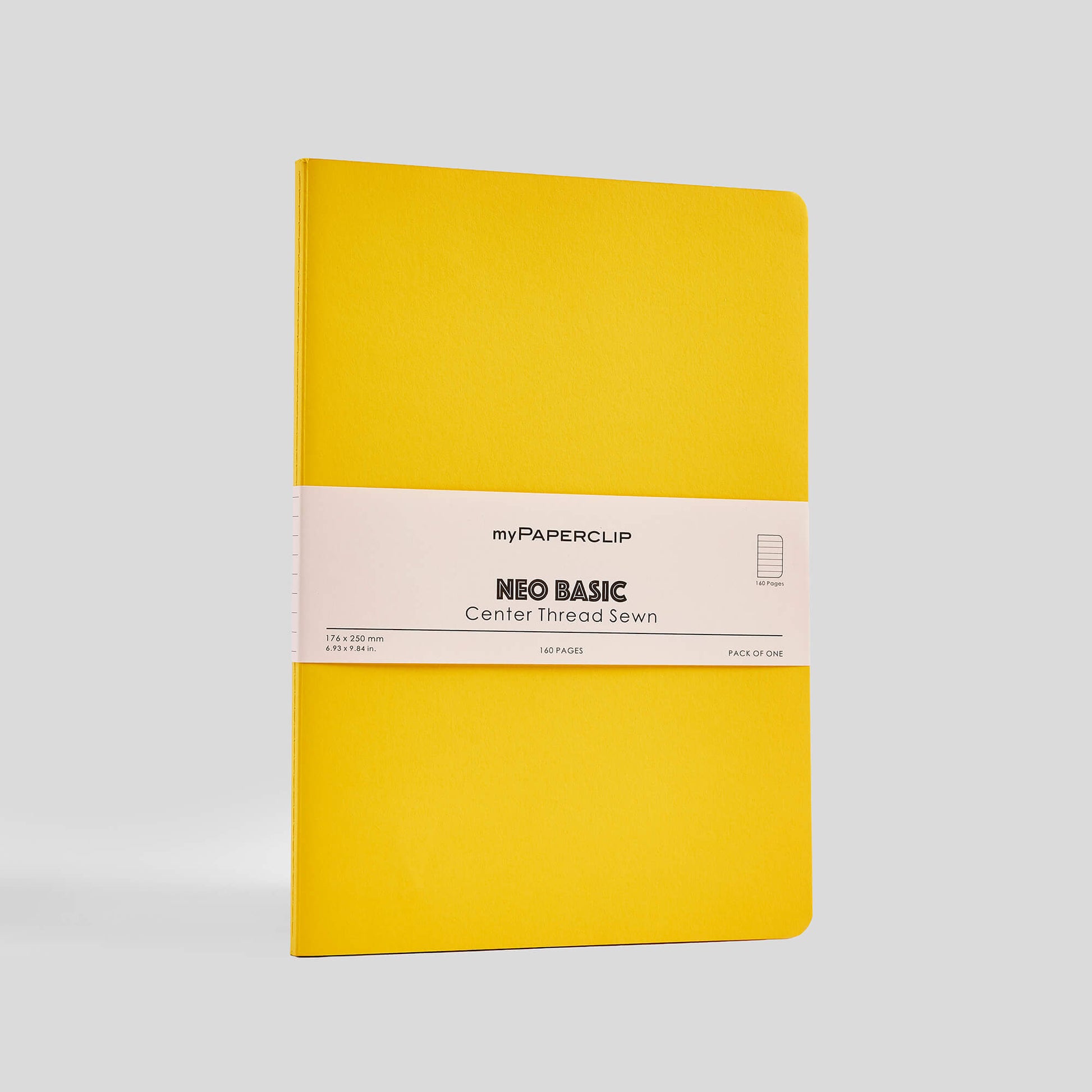Yellow notebook with a beige label on a light gray background
