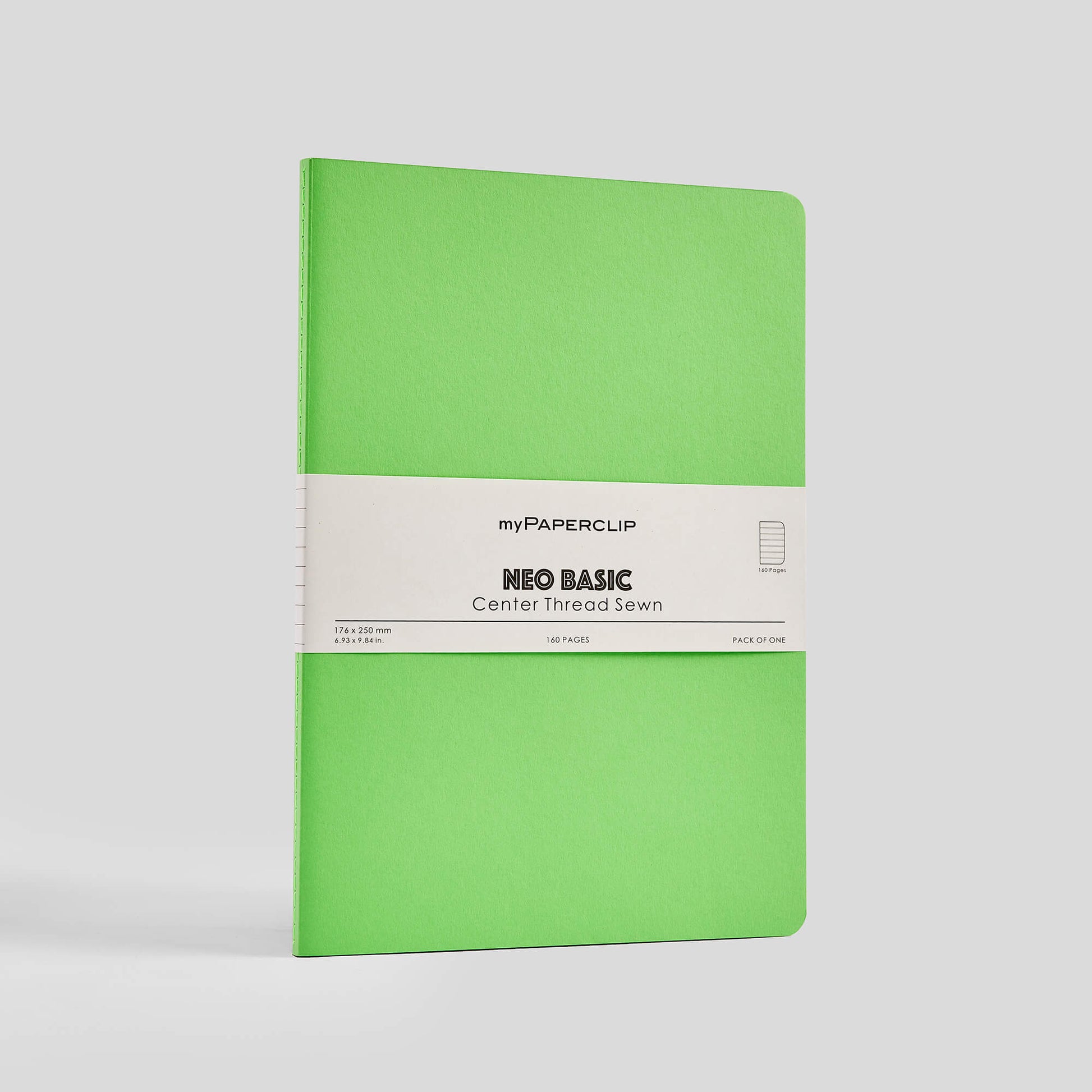 Green notebook with a white label on a light gray background