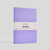 Purple notebook with a white label on a light gray background
