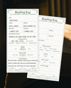 Two slips of the Amplify Reading Log on an ambient photo background. One of the slips is used, the other is blank.