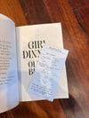 Open book with the page of an Amplify Bookstore Reading Log.