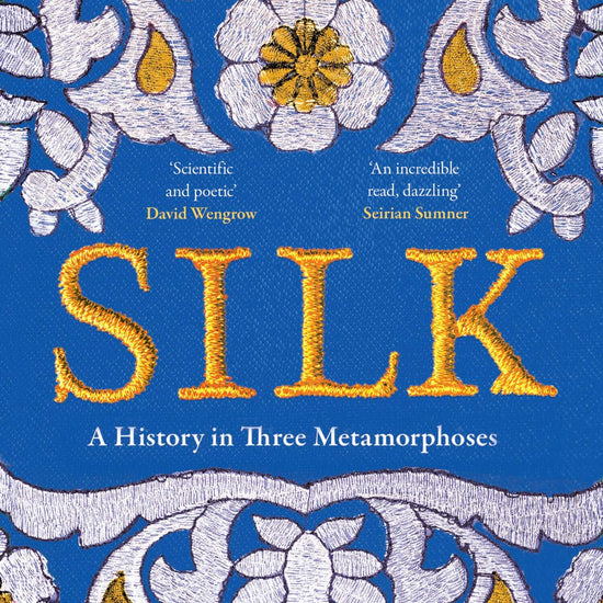 A book cover of 'Silk' by Aarathi Prasad featuring a detailed blue and gold floral and geometric patterned design.