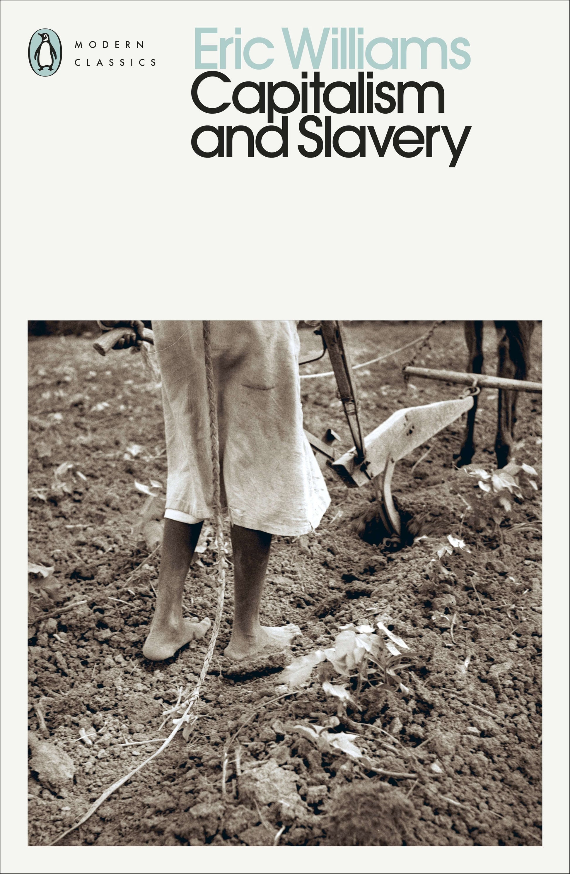 Book cover of 'Capitalism and Slavery' by Eric Williams, published by Penguin Classics. The cover features a black and white photograph of a person working in a field.