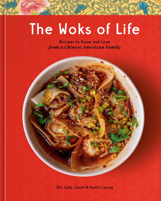 The cover of the book 'The Woks of Life' featuring a bowl of dumplings, on a red background with a floral pattern at the top.