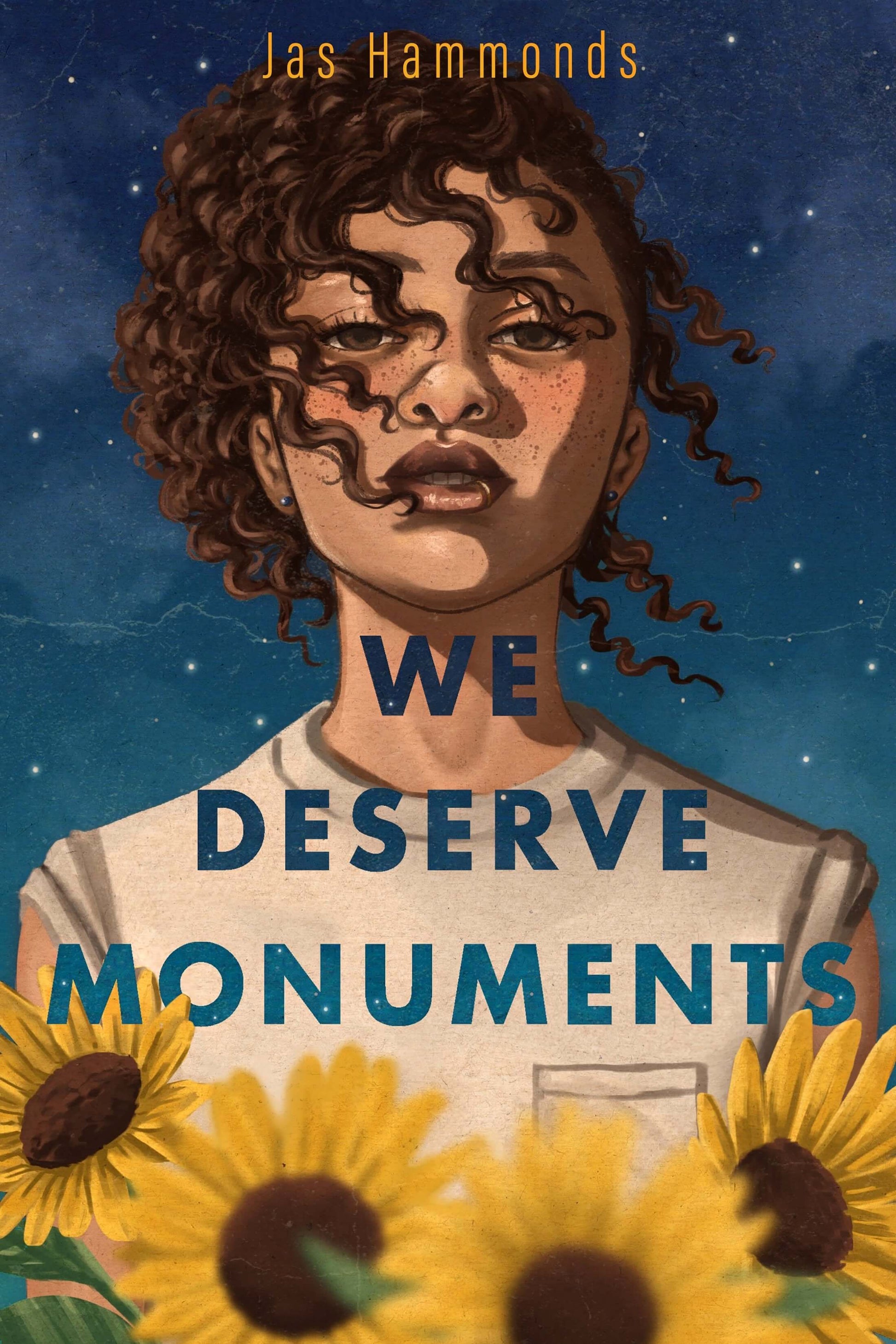 Cover of the book 'We Deserve Monuments' featuring a young woman with curly hair, set against a celestial blue background with yellow flowers